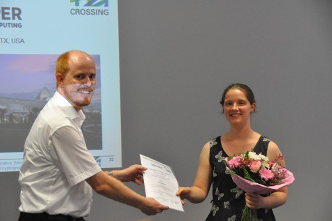 Prof. Thomas Schneider congratulates Tanja Dyroff